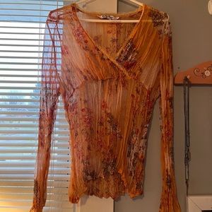 Y2K/fairy core style orange sheer long sleeve top.